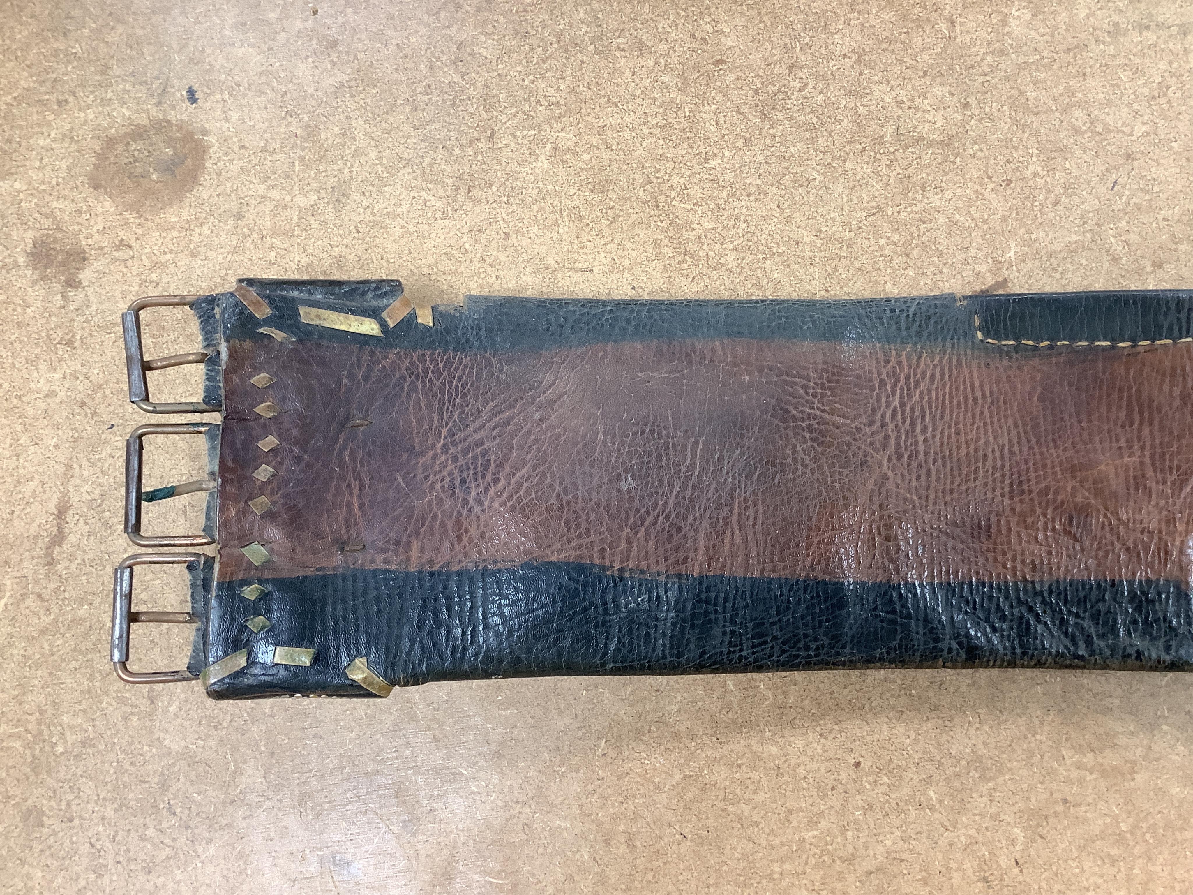 An Argentinian braided leather belt and whips, one with mother of pearl inlay